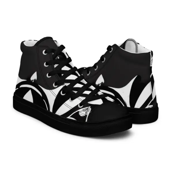 A pair of black and white sneakers with a design on them.