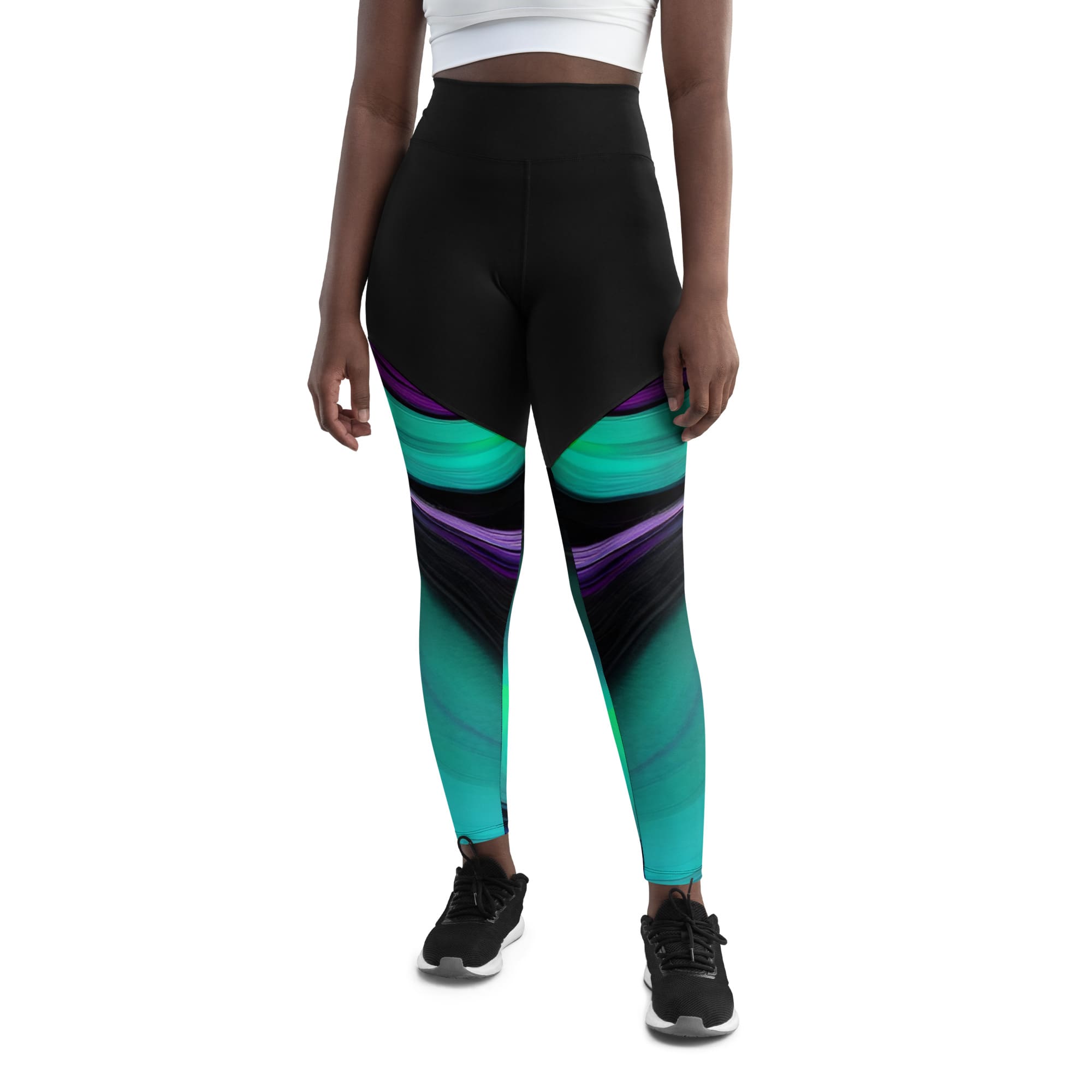 A woman wearing black and blue leggings with purple, green and white designs.