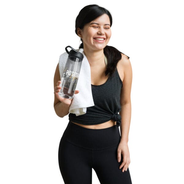 A woman holding onto a bottle of water