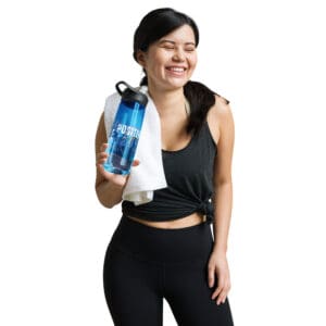 A woman holding onto a towel and water bottle