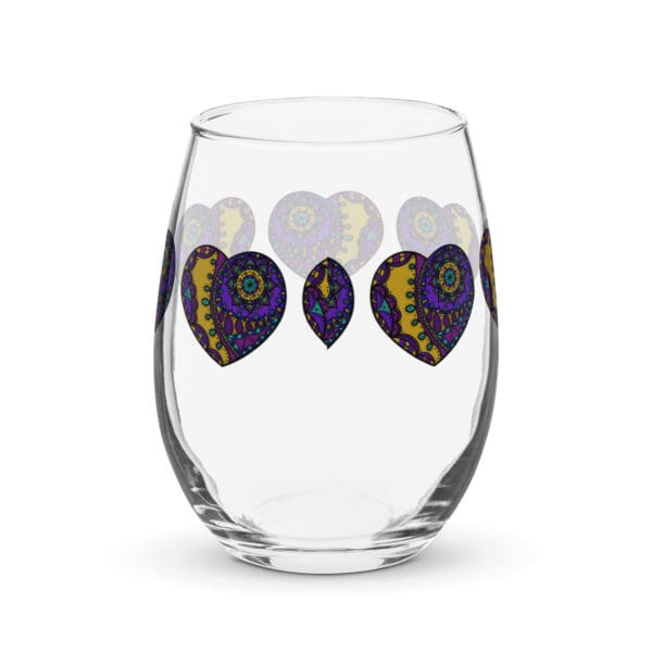 A glass with purple and yellow hearts on it