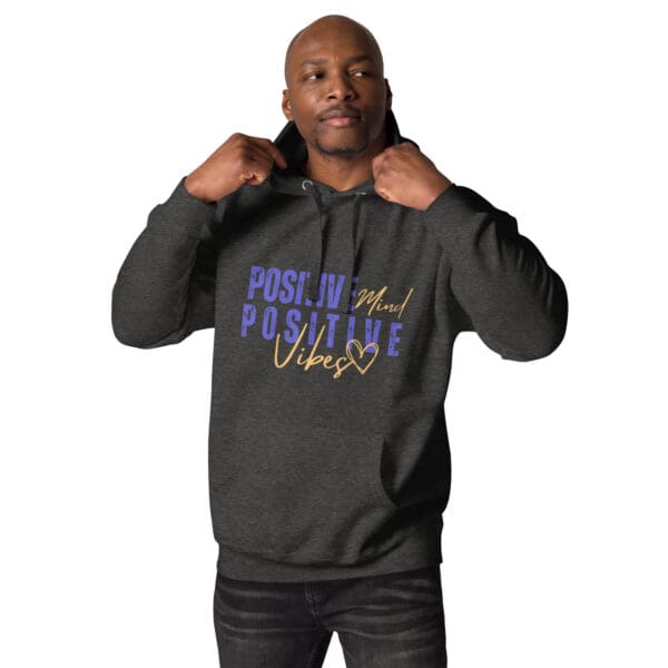 A man in black hoodie with purple and blue lettering.