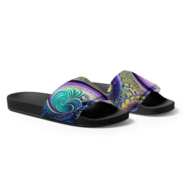 A pair of black and purple sandals with a design on them.