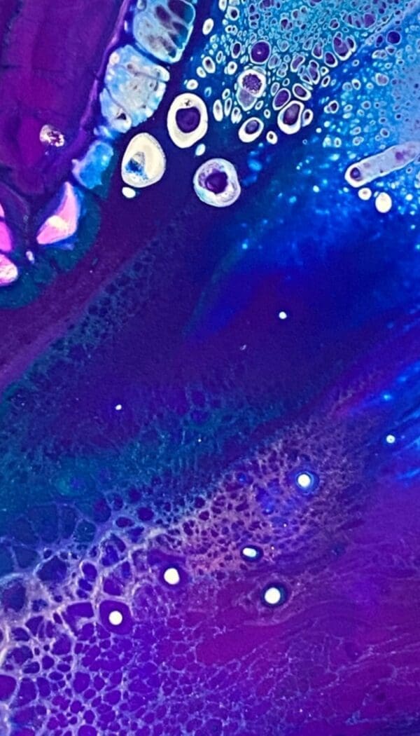 Colorful abstract fluid art with bubbles.