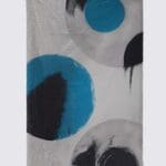 Abstract blanket with blue and black circles.
