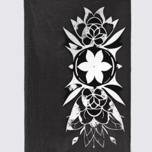 Black cloth with intricate white floral design.