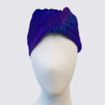 Purple patterned headband on a mannequin.