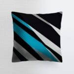Decorative pillow with blue and black stripes.