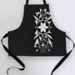 Black apron with floral white design.