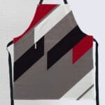 Stylish apron with geometric color blocks.
