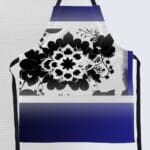 Floral patterned apron in blue and black.