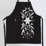 Black apron with white floral design.