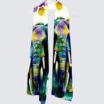 Colorful elephant print scarf displayed on hanger.