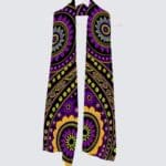 Colorful patterned scarf hanging on a hook.