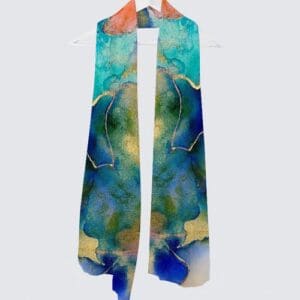 Colorful artistic scarf hanging on a hook.