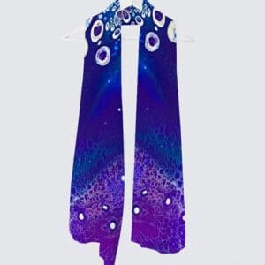 Colorful abstract patterned scarf hanging.