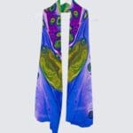Colorful scarf with abstract design hanging.