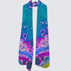 Colorful abstract scarf hanging on a hook.
