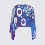 Colorful cropped shirt with abstract design.