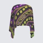 Colorful patterned shawl with fringe edges.