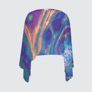 Colorful patterned shawl with flowing sleeves.