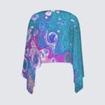 Colorful abstract design on a fabric shawl.