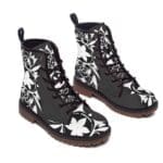 Stylish black boots with floral design.