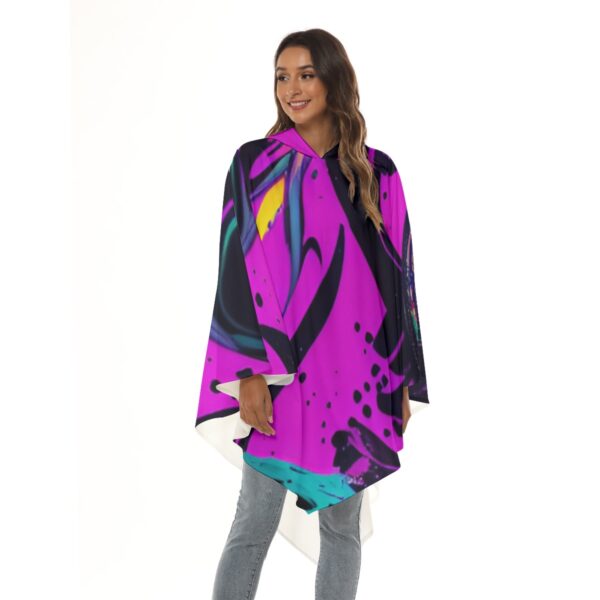 Woman wearing hooded abstract print poncho.