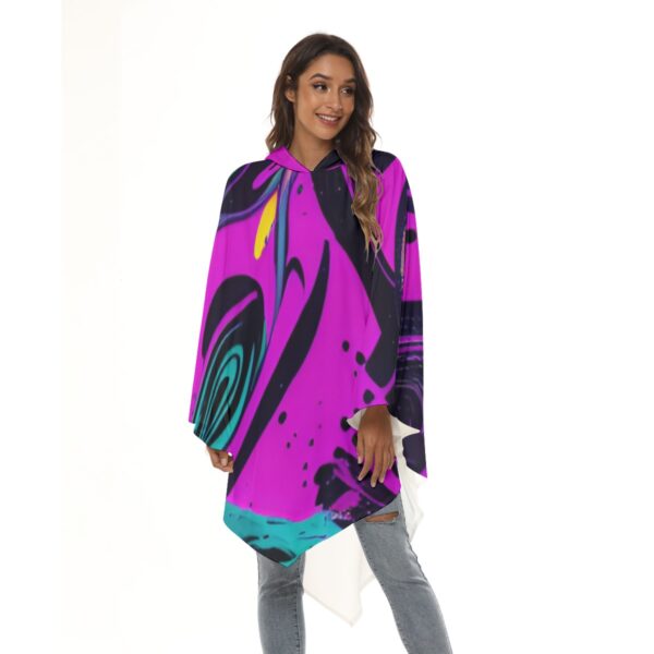 Woman in hooded abstract print poncho.