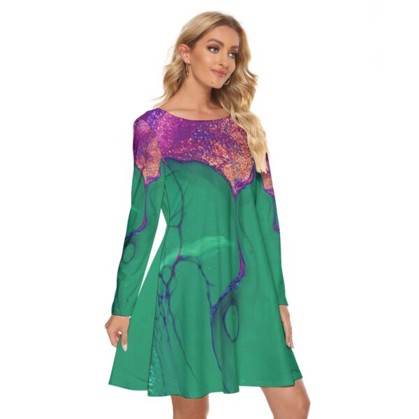 Woman in green abstract print dress.