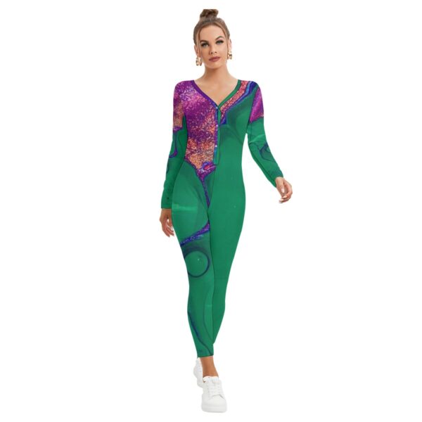 Woman in green abstract print jumpsuit.