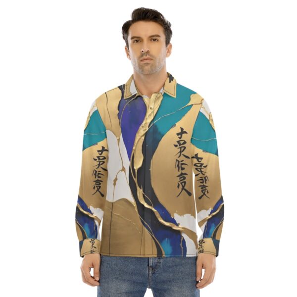 Man wearing abstract gold and teal shirt.