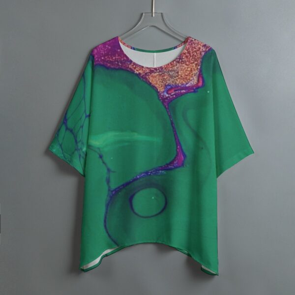 Green abstract print blouse on hanger.