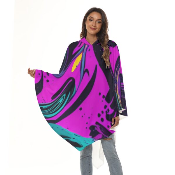 Woman wearing hooded abstract print poncho.