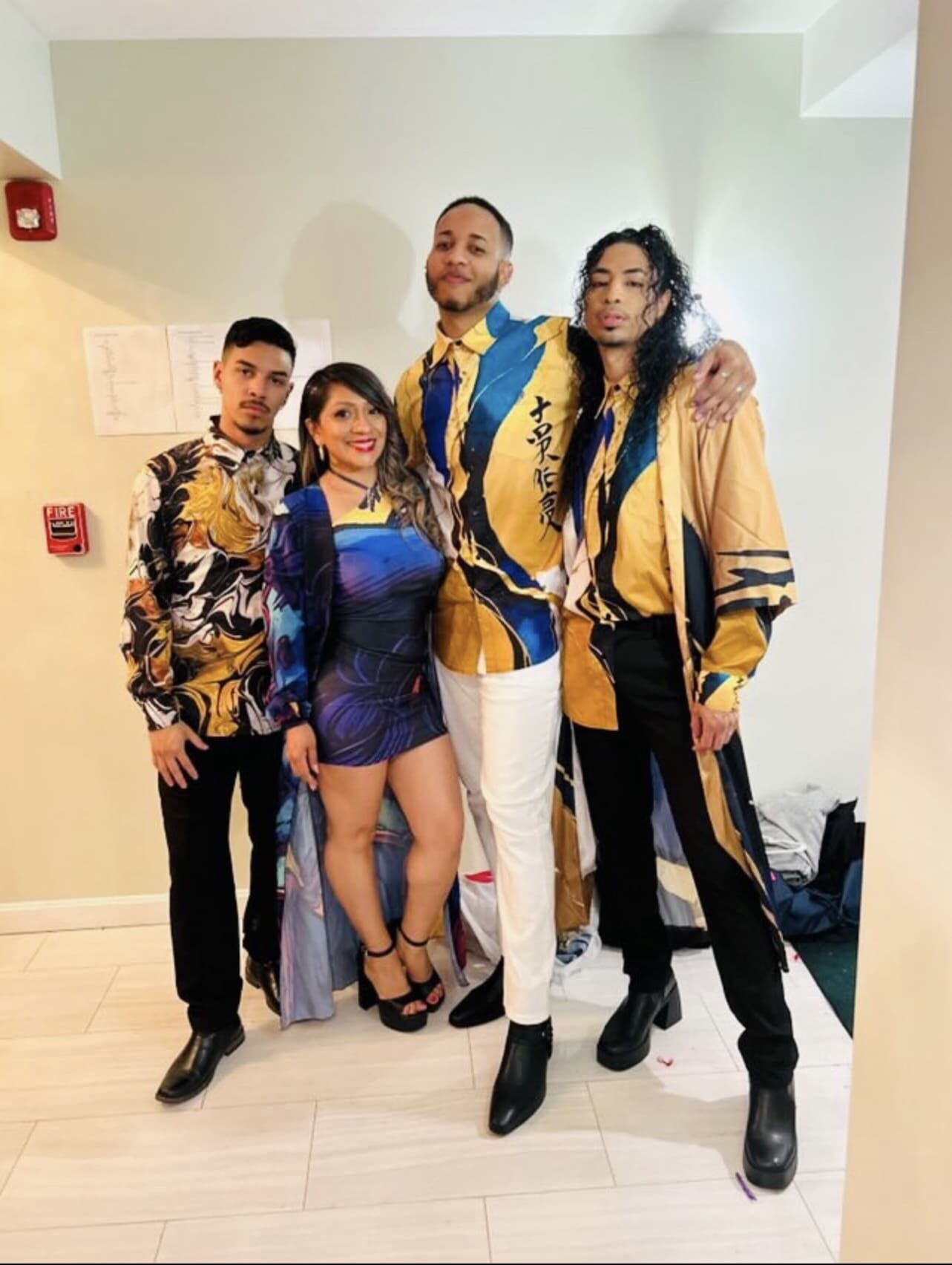 Family in matching abstract print shirts.