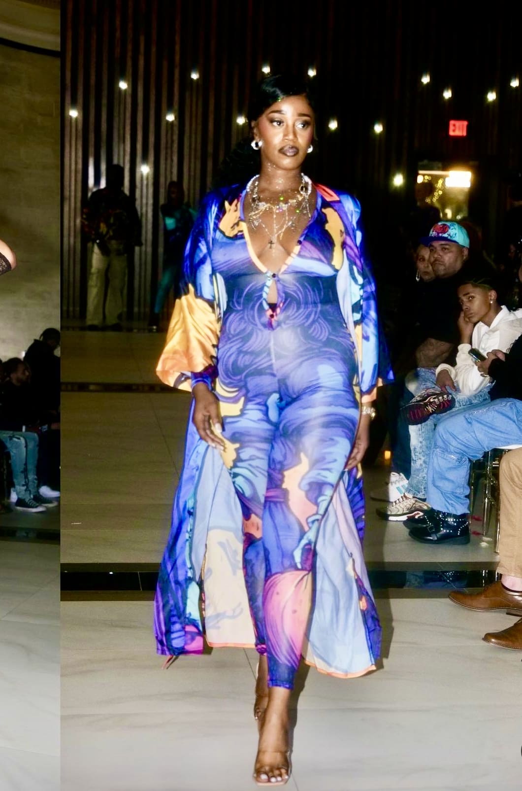 Model in blue and purple print jumpsuit.