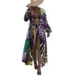 Woman in colorful robe and wide-brimmed hat.