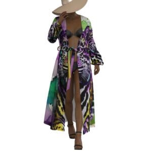 Woman in colorful robe and wide-brimmed hat.