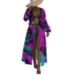 Woman in colorful robe and wide-brim hat.