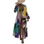 Model in colorful robe and wide-brim hat.