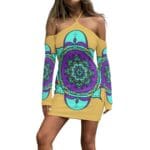 Colorful patterned off-shoulder dress on model.