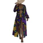 Woman in colorful patterned robe and hat.