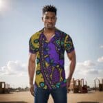 Man in colorful patterned shirt outdoors.