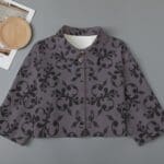 Cropped jacket with floral patterned design.