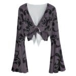 Purple bell sleeve crop top with black pattern.