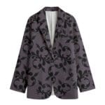 Purple blazer with black floral pattern.