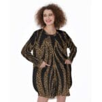 Woman in long-sleeved leopard print dress.