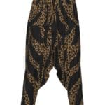 Leopard print harem pants on white background.