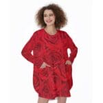 Woman in red rose print tunic dress.