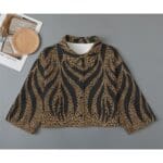 Leopard print button-up shirt.
